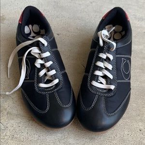 A cute pair of blue coach tie up shoes
